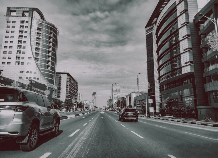Black and white city street scene in Kinshasa; photograph of Democratic Republic of the Congo